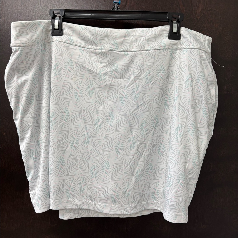 White and lt blue skirt, has built in shorts with Leaf Pattern